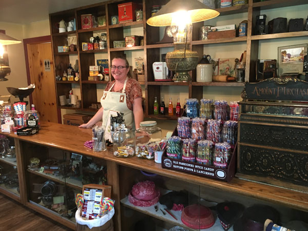 A woman behind the counter at the Township's candy store